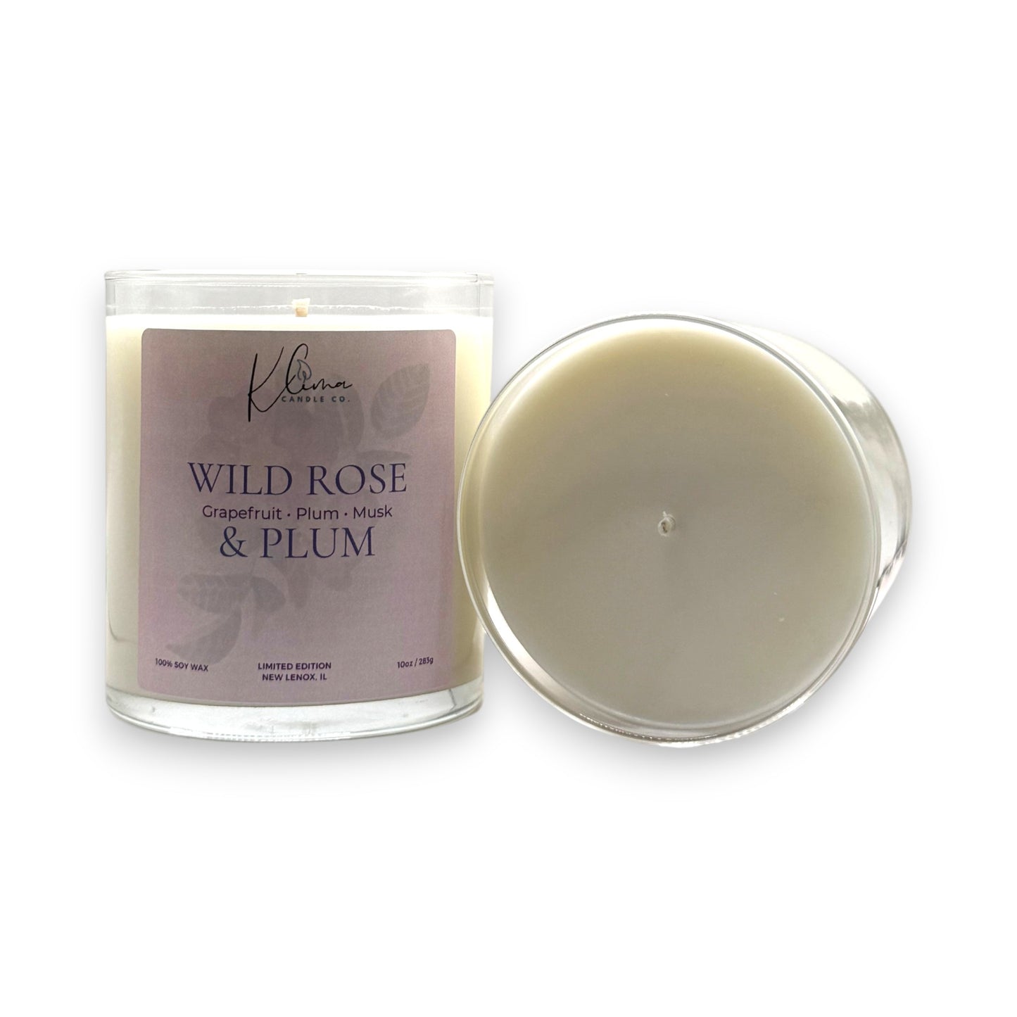 Klima Candle Co. Wild Rose Grapefruit Plum Musk 10oz soy wax candle in clear glass jar with purple label.